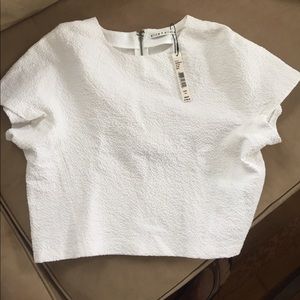 Never been worn Alice+Olivia cream cropped top